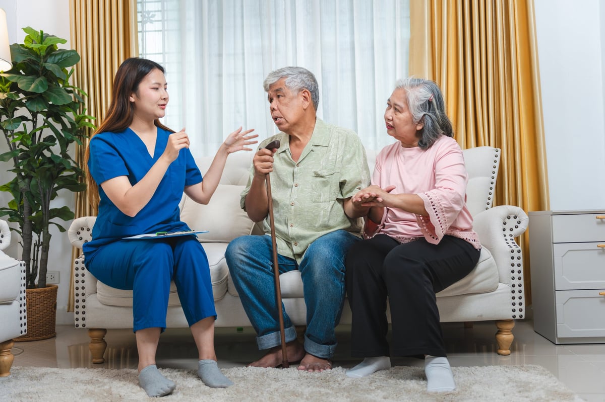 Continence nurse advising a family during an in-home consultation