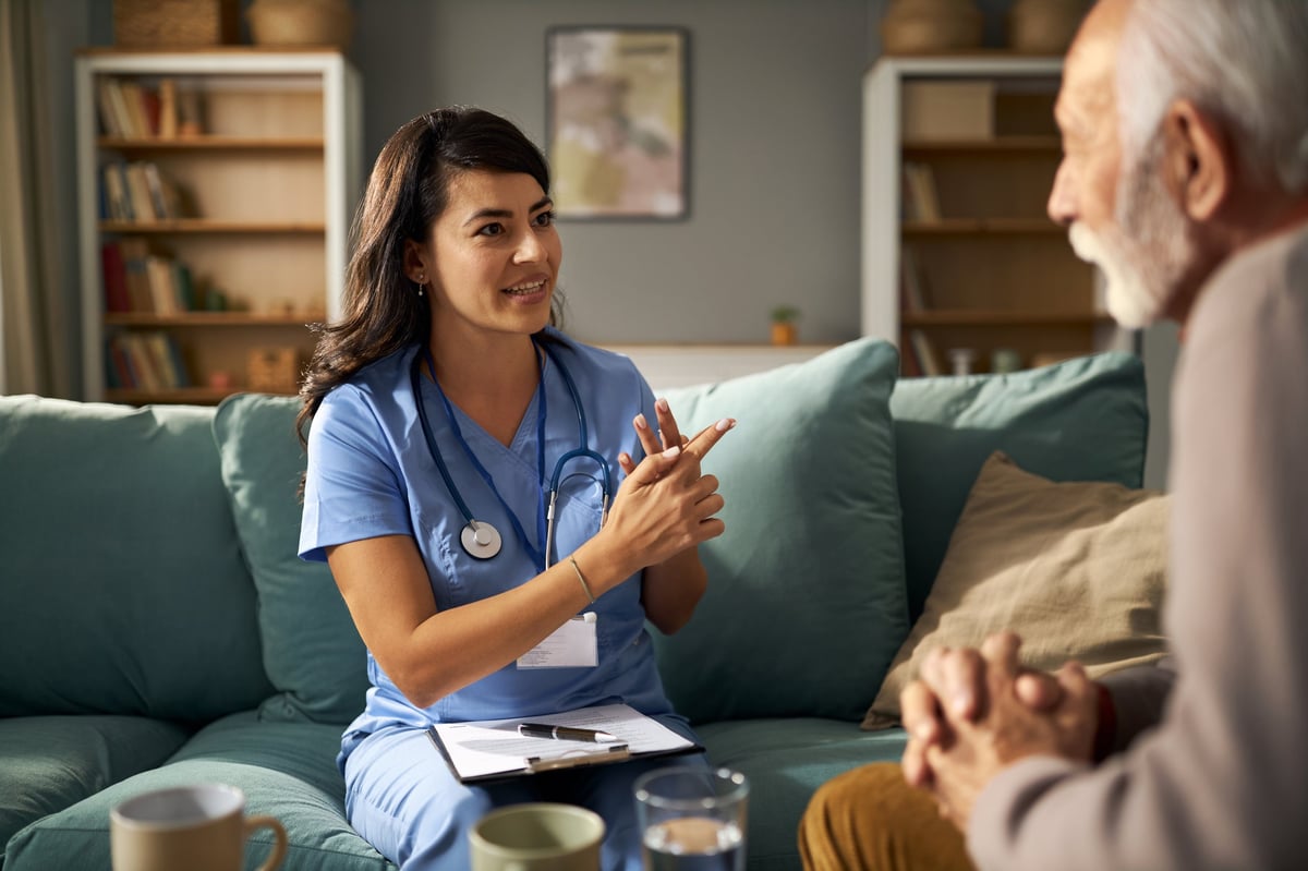 Qualified continence nurse conducting an in-home continence assessment with a client